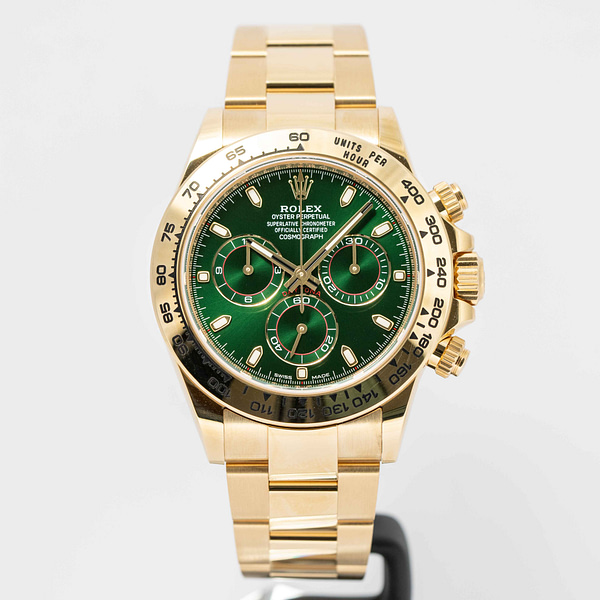 Rolex daytona gold shop green dial price