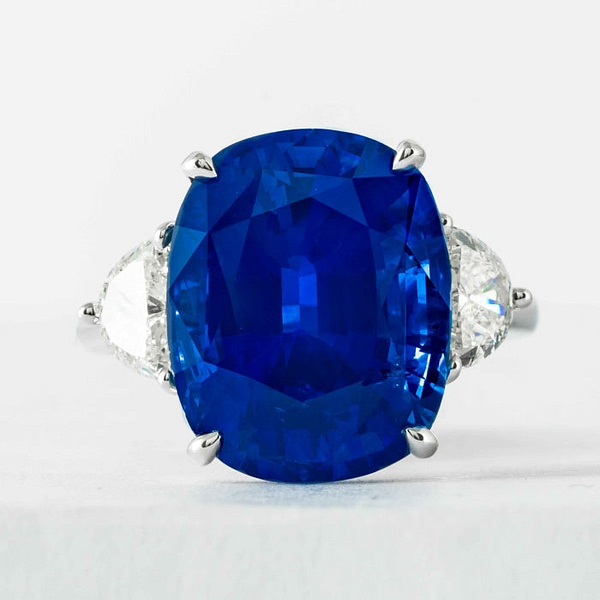 https://mlbxevudnuj9.i.optimole.com/cb:s9RE.27c38/w:600/h:600/q:mauto/rt:fill/g:ce/f:best/https://shrevecrumpandlow.com/wp-content/uploads/2022/09/13-02-carat-cushion-cut-sapphire-diamond-3-stone-platinum-ring-100000-200000-jewelry-rings-shreve-crump-low-631.jpg