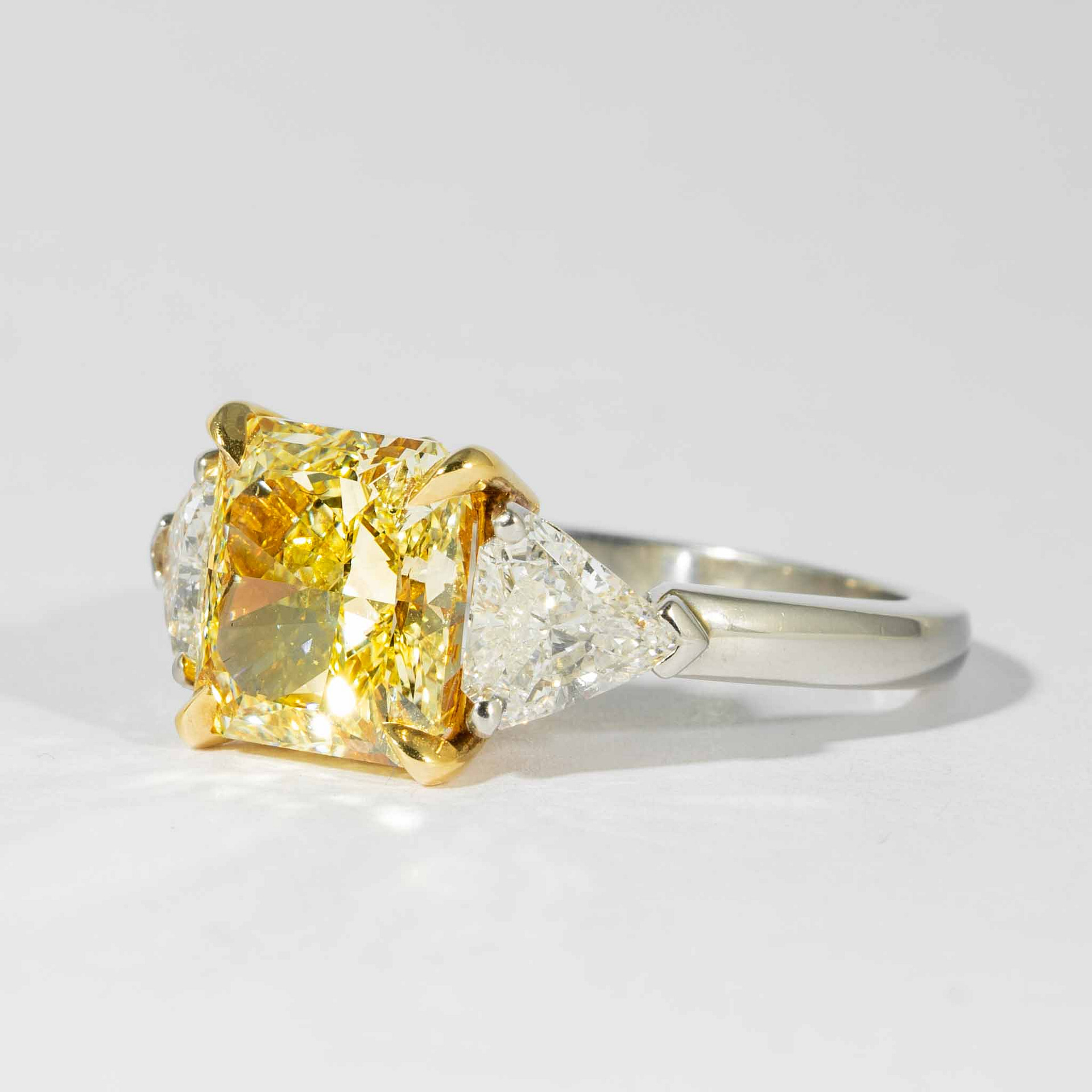 3.64 carats Fancy Yellow VS2 Radiant Cut Canary Diamond Three