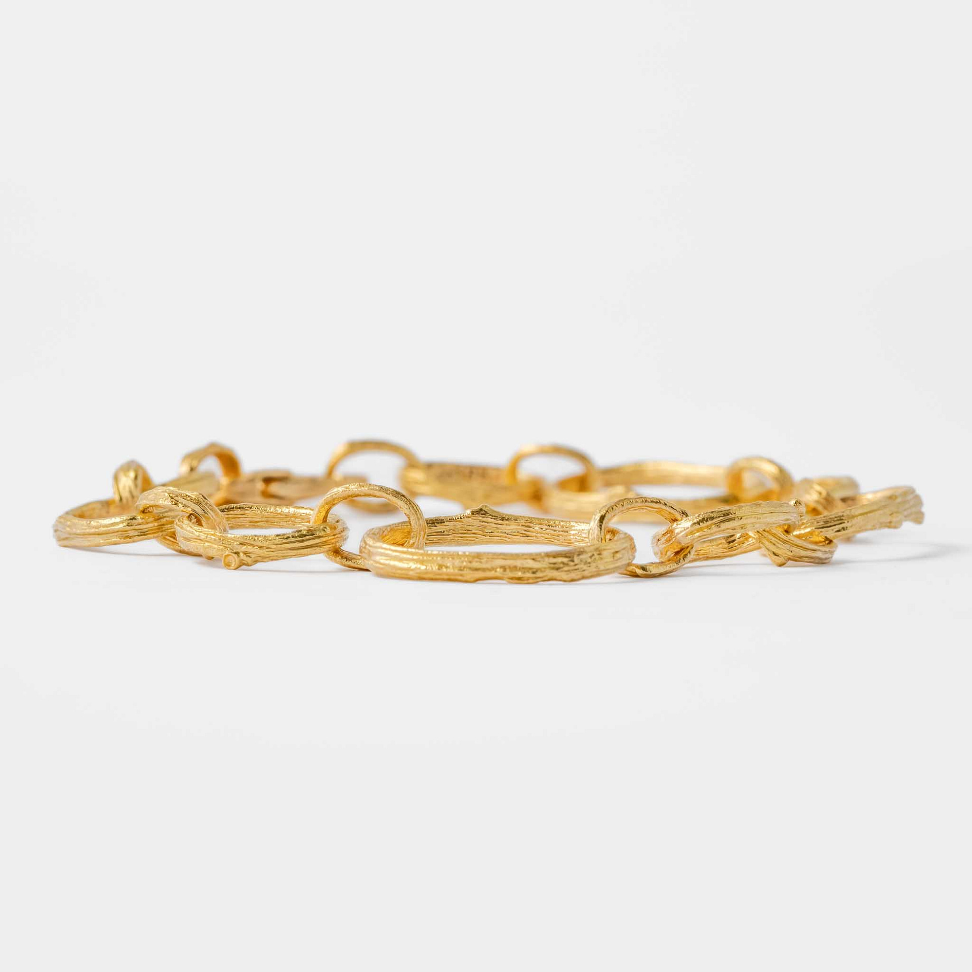 Large and Small Open Olive Branch Link Bracelet with Diamond Clasp in 19kt  Yellow Gold